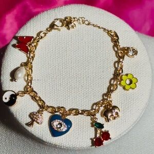 Charming Gold Charm Bracelet with Colorful Accents